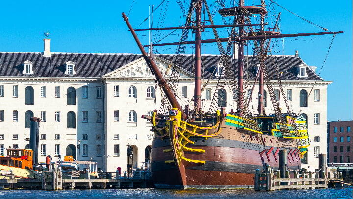Wooden sailing ship moored in front of the Maritime Museum