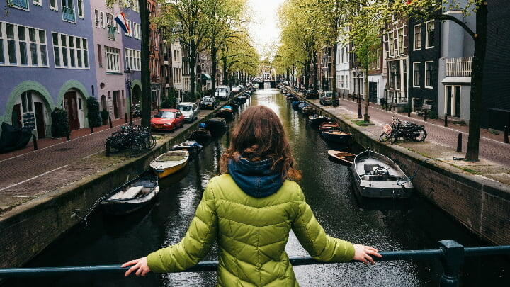 Woman overlooking a canal in Amsterdam