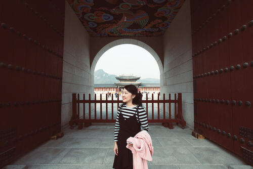 A single woman explores the palace grounds in Seoul