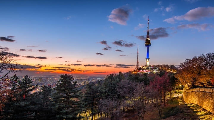 Seoul at sunset, the skyline dominated by Mount Namsan and its iconic tower.