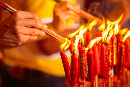 Monks light incense in a Chinese temple
