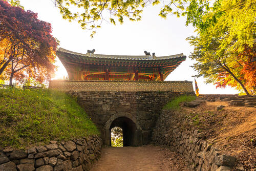 Stone walls and gate of the old fortress walls around Seoul