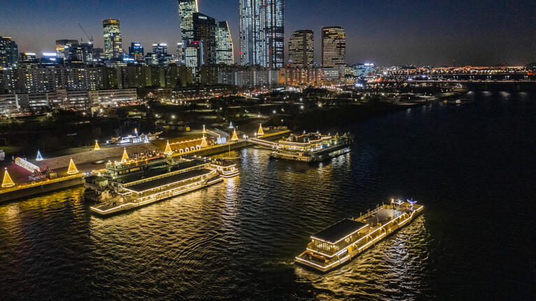 Boats on the Han River, Seoul, lit up at night