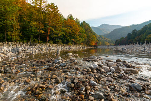 Pebbled stream with mountains in the background at Mt Seorak National Park