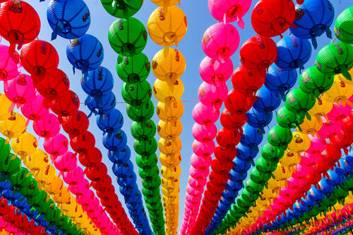 rainbow lanterns hang in the street