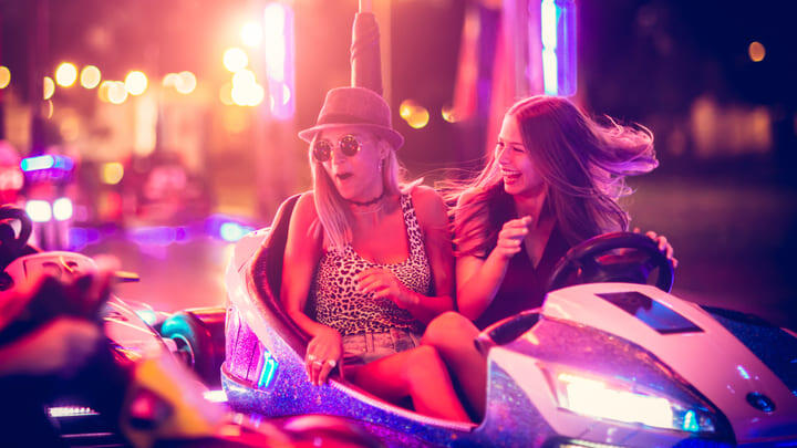Friends having fun on the bumper cars.