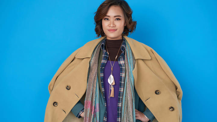 Woman wearing several layers of warm clothes.