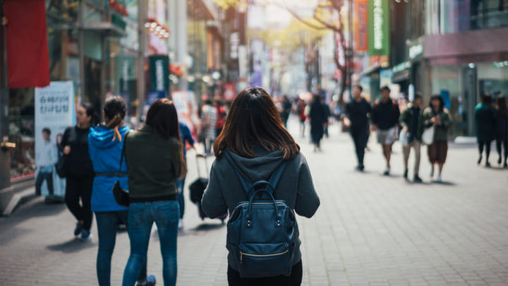 Tourists in the busy Myeongdong shopping district.
