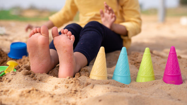 Child playing on a sandy beach