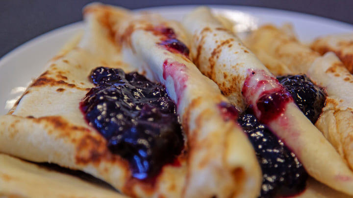 Plate of Swedish pancakes with jam toppings