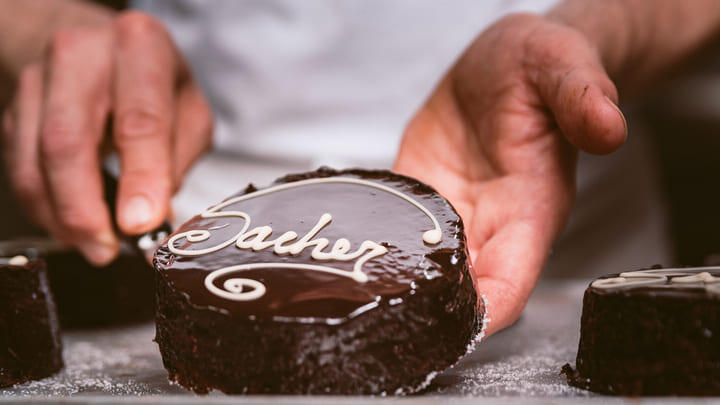 A glossy slab of Sachertorte served in Vienna.