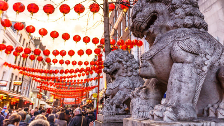 Fearsome stone lions in London's Chinatown district.