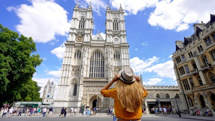Tourist outside Westminster Abbey in London.