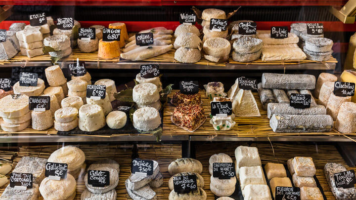 Huge variety of cheeses on sale at a Paris market.