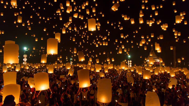 Hundreds of lanterns lighting up the night sky at a lantern festival