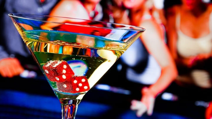 Cocktail with red dice in it.