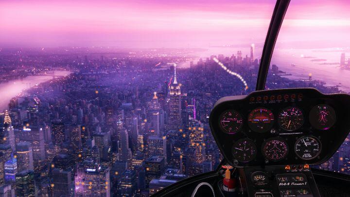 View of NYC from a helicopter, with close up of console and the distant city lit with a purple sky