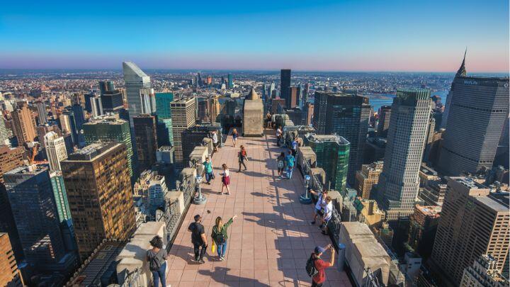 People on 70th floor observation walkway of TOTR, overlooking New York city skyscrapers