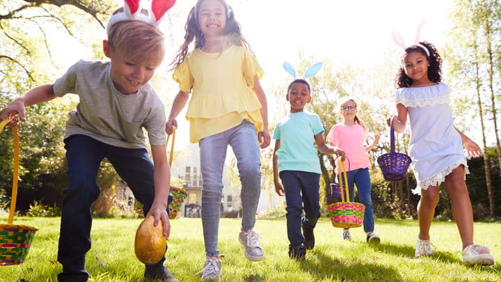Kids on an Easter egg hunt in the park.