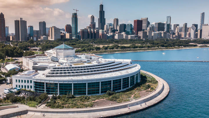 The Shedd Aquarium pictured against the Chicago skyline, on the shores of Lake Michigan.