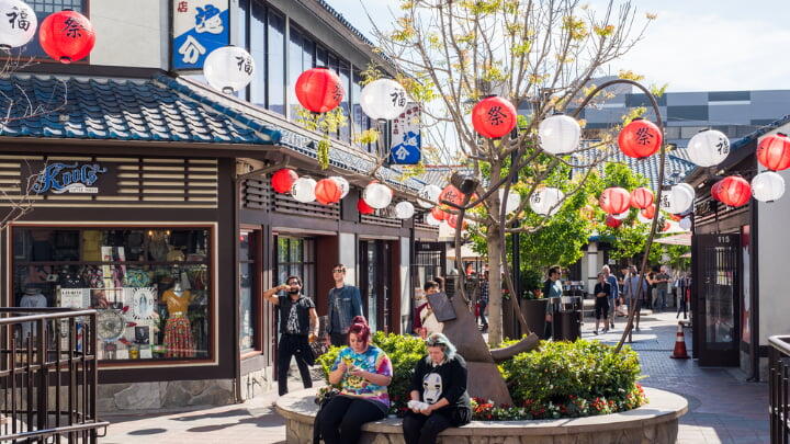 Tourists taking a break on a circular bench in Japantown