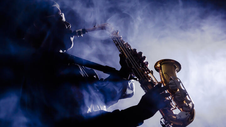 Jazz saxophonist performing in a smoky club