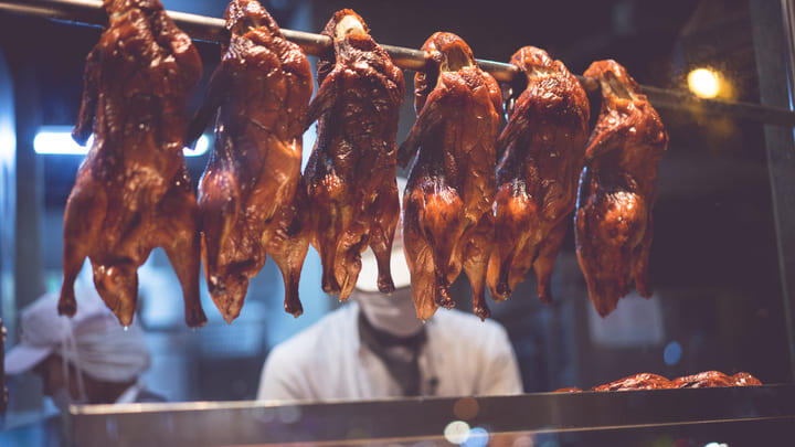 Chinatown chef preparing roast duck