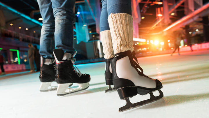 Pair of ice skaters on the rink.