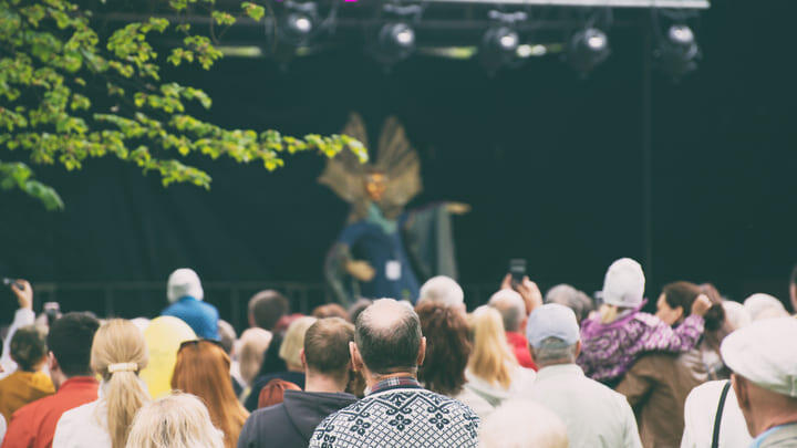 Audience watching a performance at an outdoor theater
