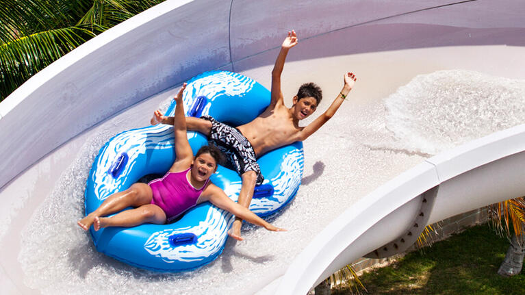 Kids enjoying the thrill of the rides at Ventura Park
