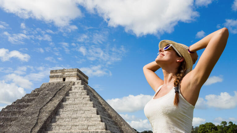 A woman enjoying the sights at Chichen Itza