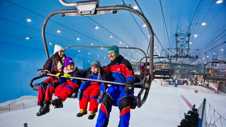 A family on the chair lift at Ski Dubai at Christmas