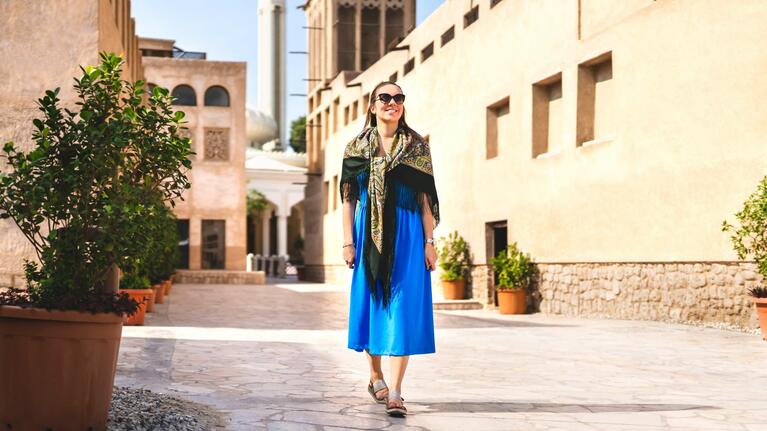 A woman walks through Al Fahidi Dubai