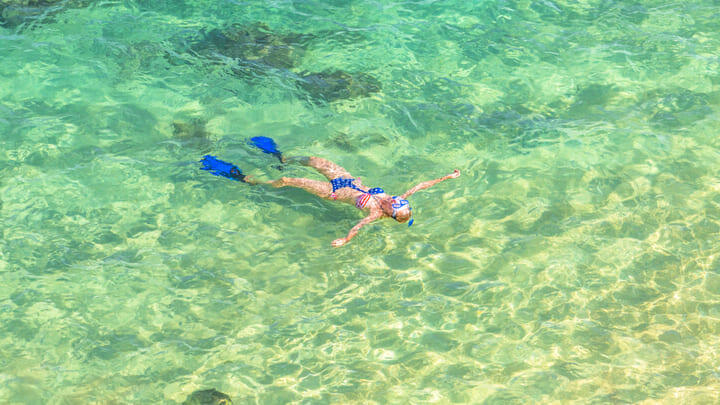 Snorkeler in Hanauma Bay State Park, Oahu, Hawaii.