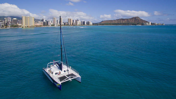 Catamaran on the water by Honolulu and Diamond Head, Hawaii.