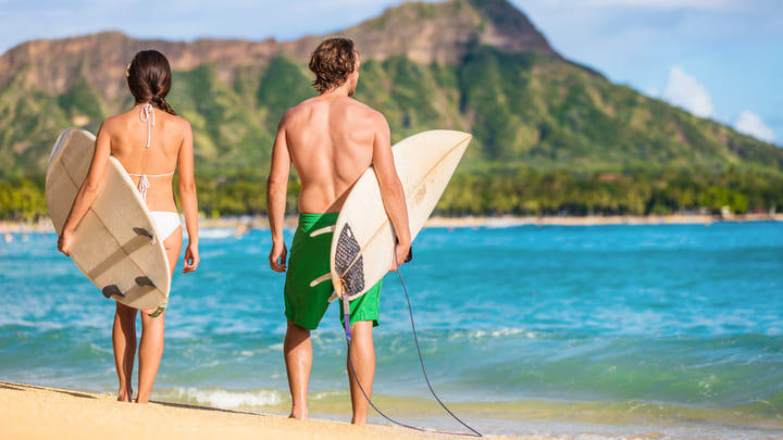 Surfers on Waikiki Beach, Oahu.