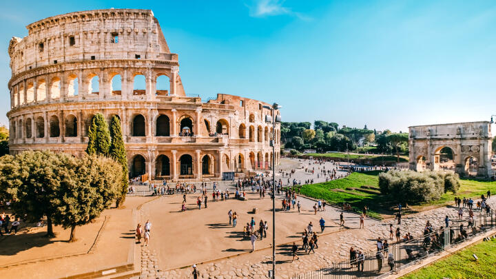 Tourists milling about the grounds of the Colosseum