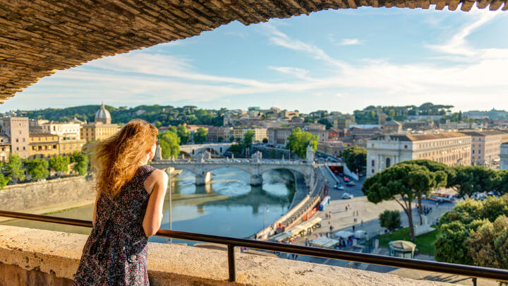 Young woman admiring the view of Rome from Castel Sant'Angelo