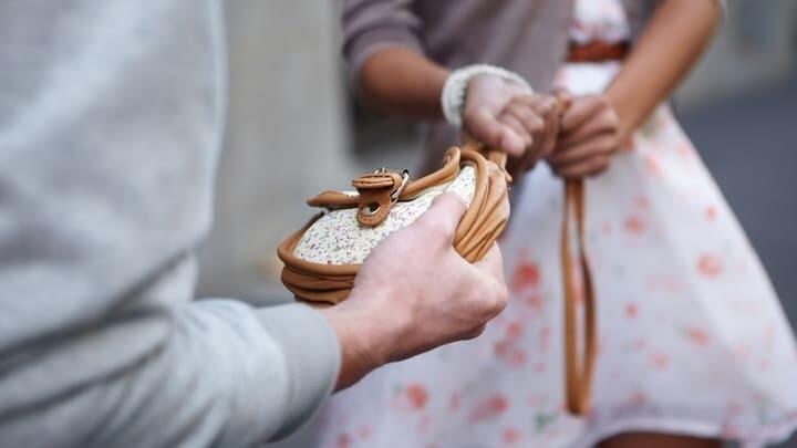 Their attempting to steal a woman's purse