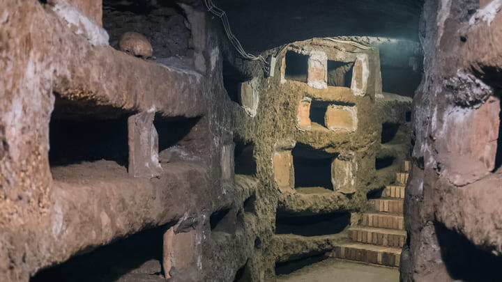 View of the narrow tunnels and stairways inside the Rome Catacombs
