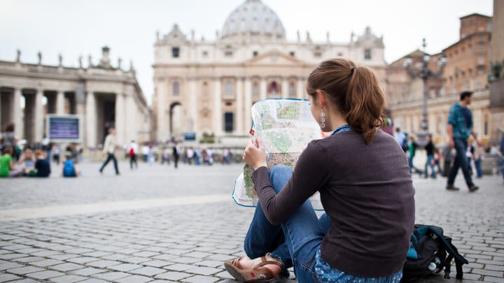 Woman reading a map in the Vatican City, Rome