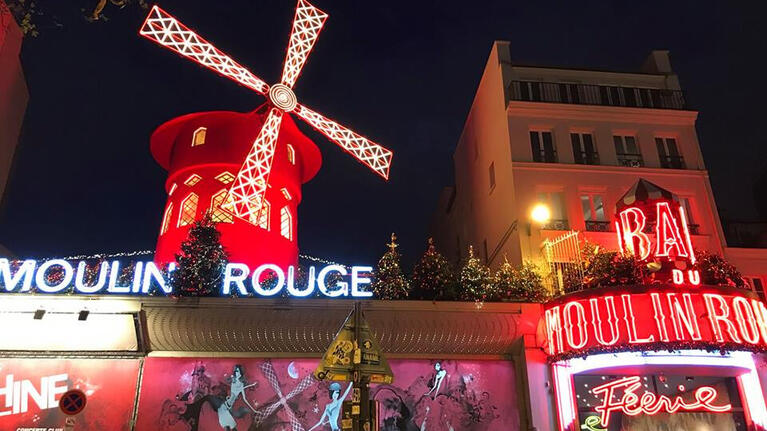 The exterior of the Moulin Rouge Cabaret Club at night