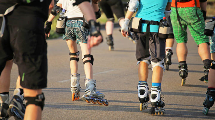 Rollerbladers skating through the streets