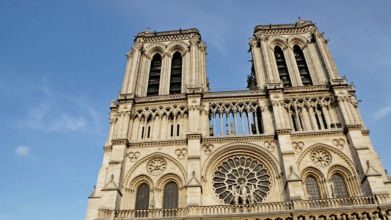The front facade of Notre Dame Cathedral on a clear day