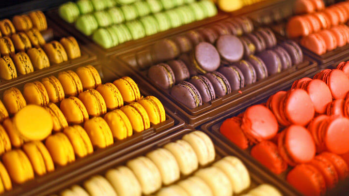 A colourful selection of macarons in a Paris shop window