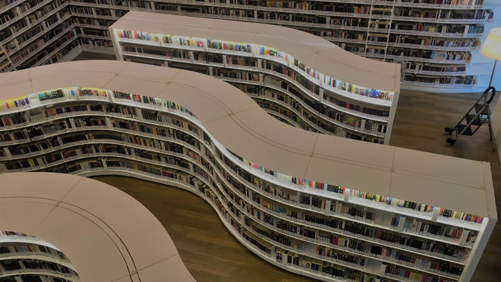 Wave-shaped bookshelves inside Singapore's Library@Orchard