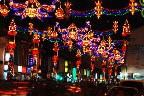 Colored lanterns hang in the street at night in Little India, Singapore