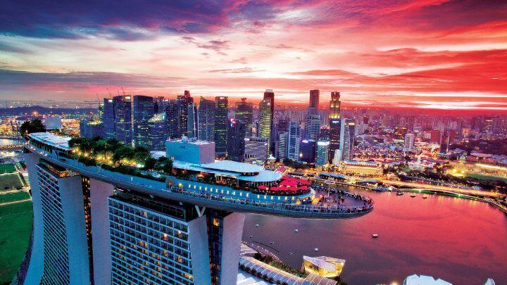 The ship atop Marina Bay Sands Hotel against a dramatic red and purple sky
