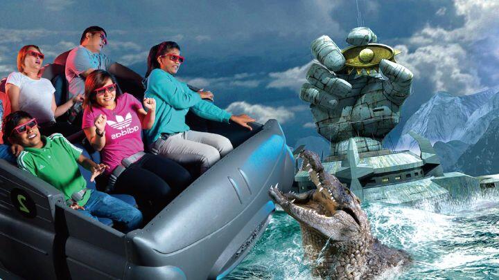 Virtual image of a crocodile rising out of the water towards a ride boat full of people - Mysterious Island ride
