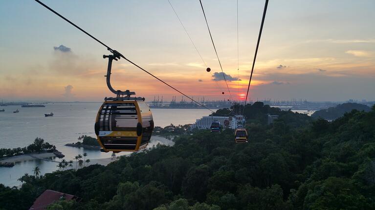 Cable car traveling to Sentosa Island at sunset
